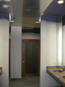 Bathroom with stainless steel on ceiling.