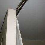 ...but the door hits the curved shower curtain rod first.