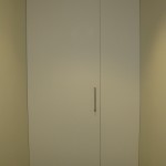 Restroom vestibule unequal leaf pair.